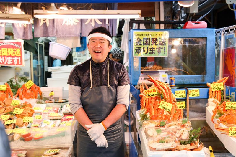 Happy Local Vendor In Tsujiki Fish Market Tokyo Japan With Tourist Japan