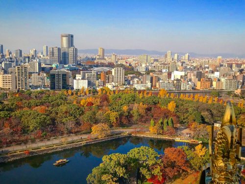 Osaka Skyline Blue Yodo River Surrounded By Buildings And Trees